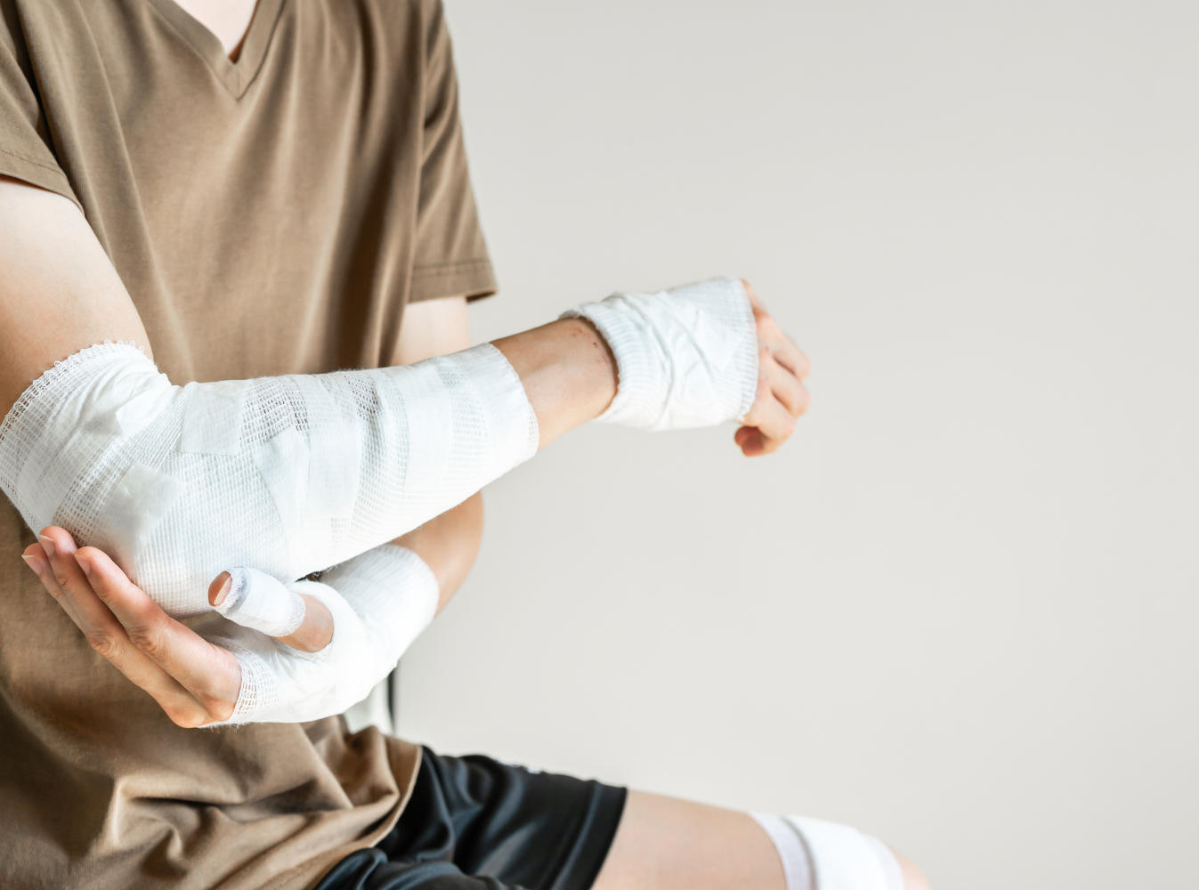 injured person wrapped arms in gauze