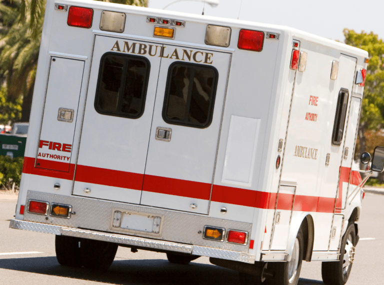 the back of an ambulance on a road