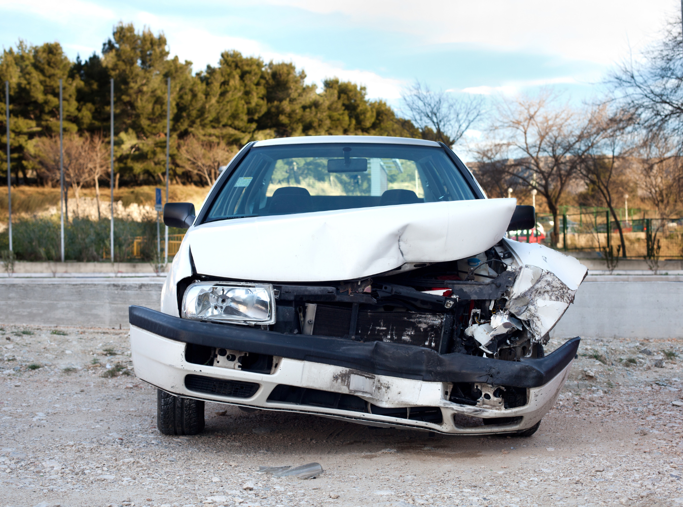 a white car with front end damage